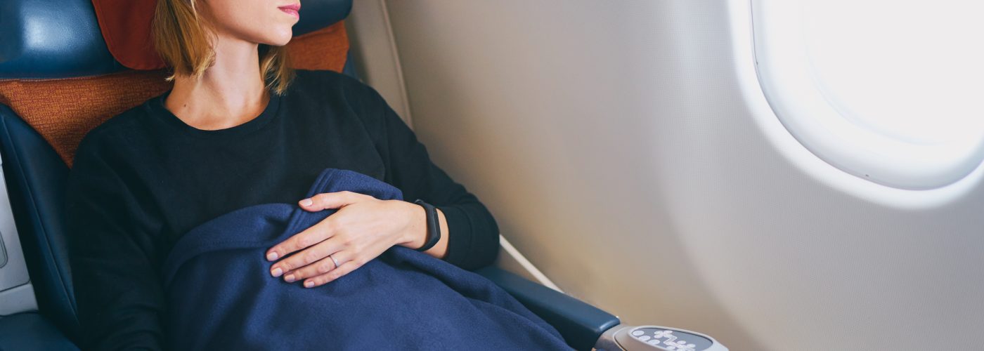 woman sleeping on plane