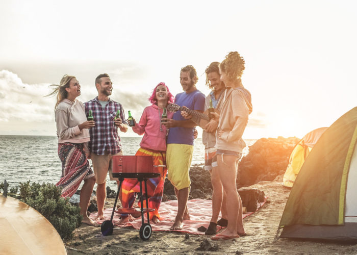 Friends having a cookout on the beach