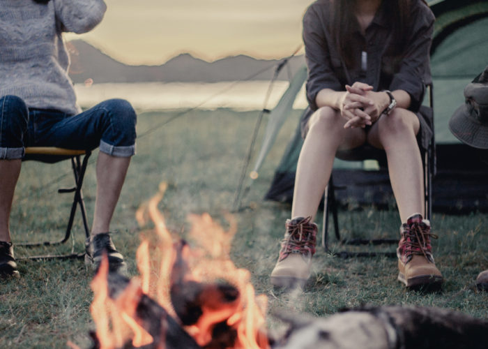 People sitting around a campfire