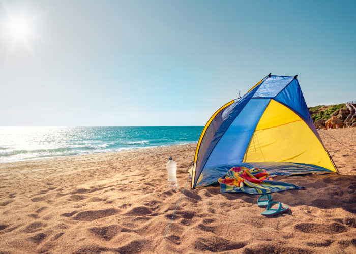 Empty tent on the beach in front of the ocean
