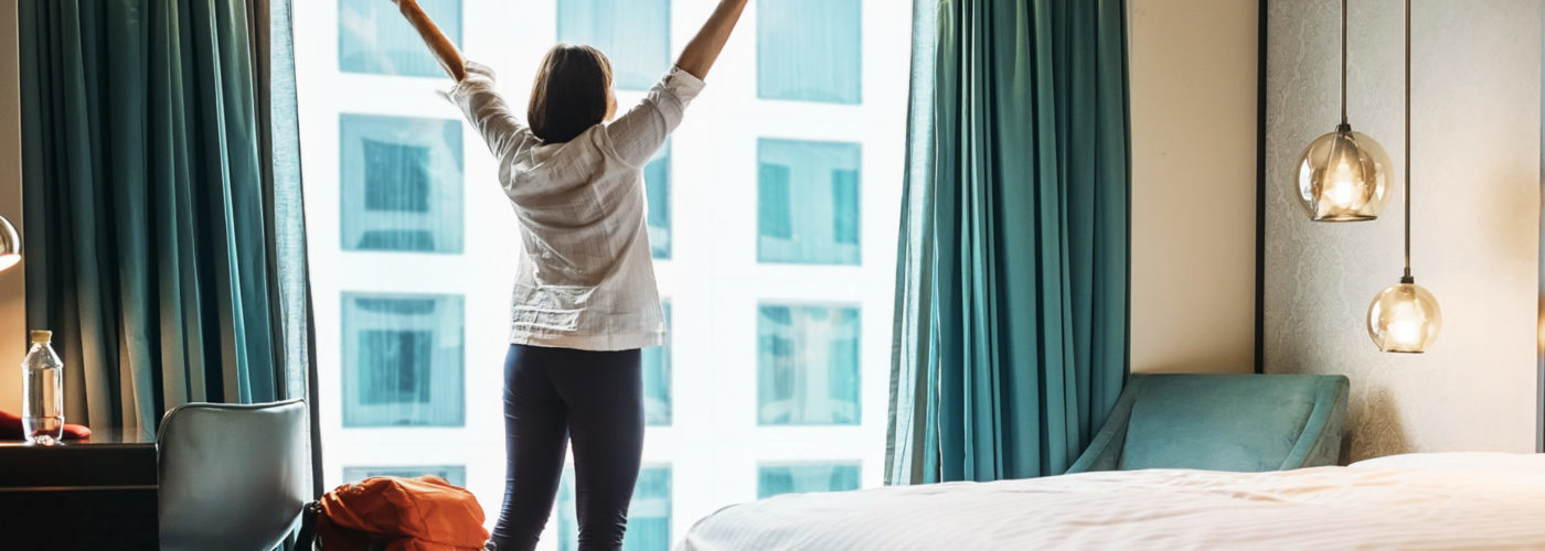 Woman stretching in hotel room