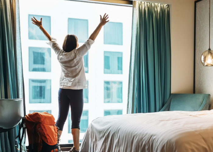 Woman stretching in hotel room