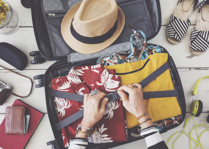Woman packing suitcase